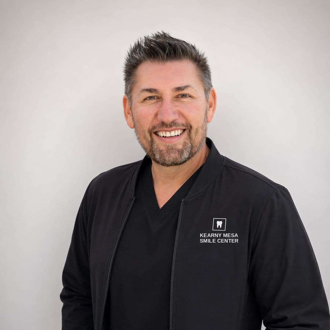 Dr. Paulo F. Cortes, DMD, in a Kearny Mesa Smile Center jacket
